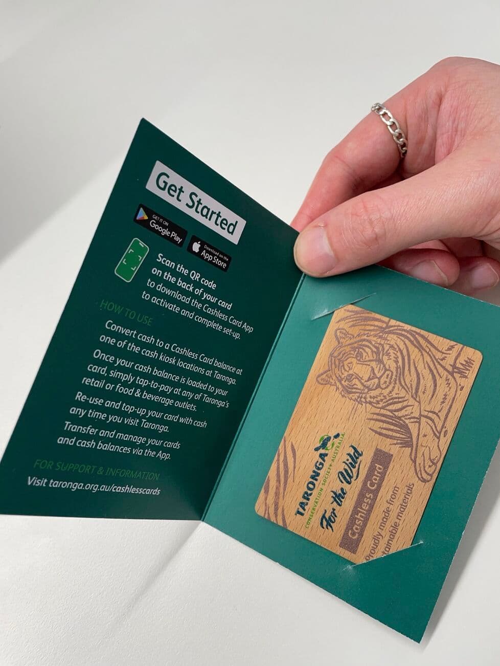 Taronga Zoo cashless card — a wooden NFC card with tiger illustration